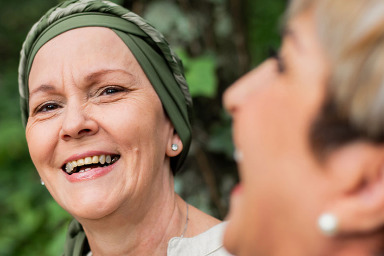 Two women outside laughing