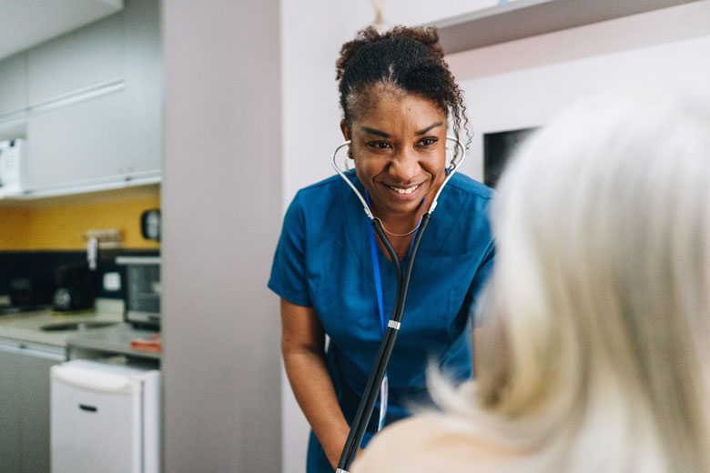 Female Healthcare Nurse with Patient