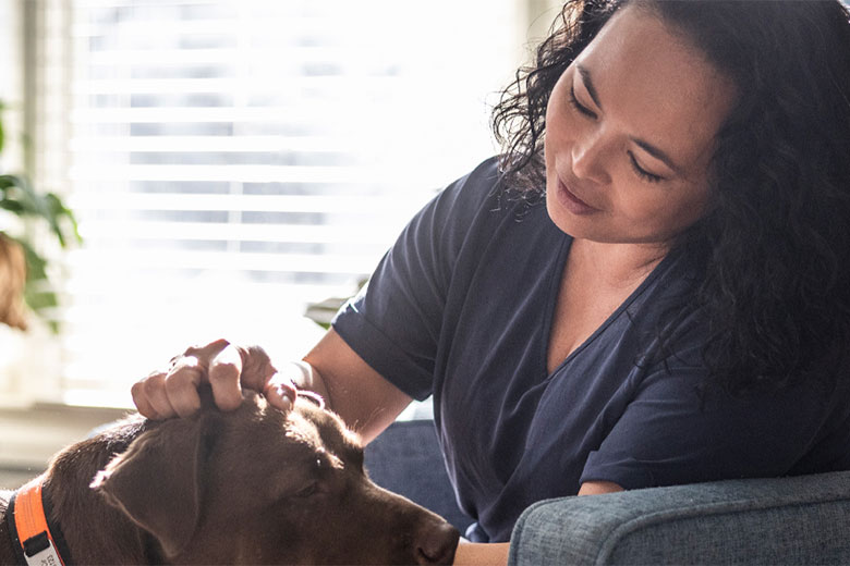 Woman petting dog